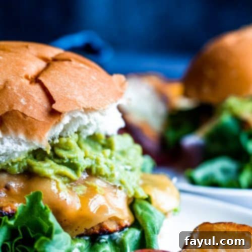 A delicious grilled chicken burger with guacamole and garlic aioli
