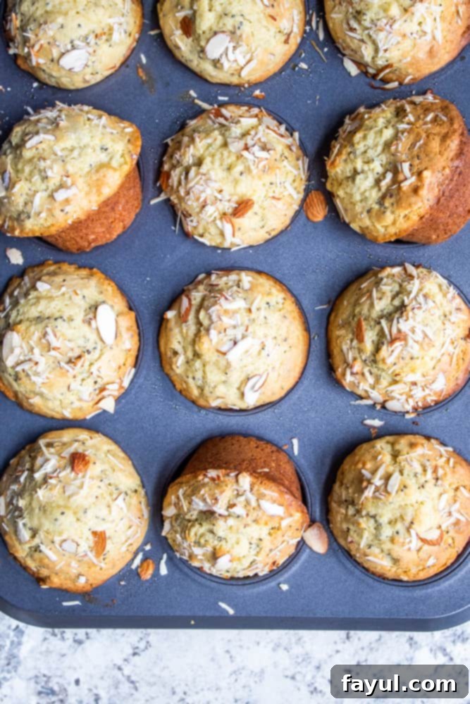Overhead shot of muffins in the pan with some turned.