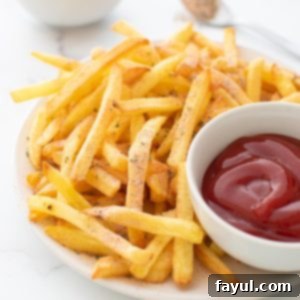 Easy homemade seasoning mix for french fries, presented in a small bowl.