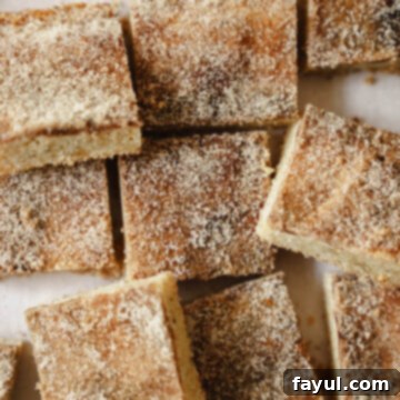 Brown Butter Snickerdoodle Blondies with a fork on a white plate