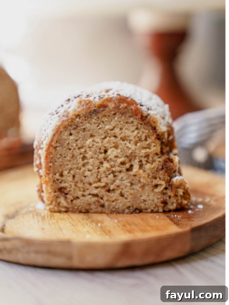 Delicious Apple Cider Donut Bundt Cake, dusted with powdered sugar
