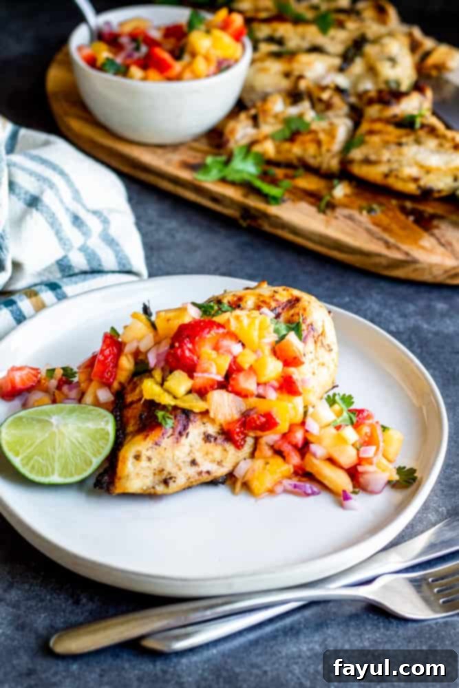 Perfectly grilled cilantro lime chicken breasts, sliced and ready to serve, with fresh lime wedges and cilantro garnish. A vibrant and healthy meal.