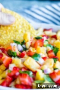 Close up shot of salsa in a white bowl.