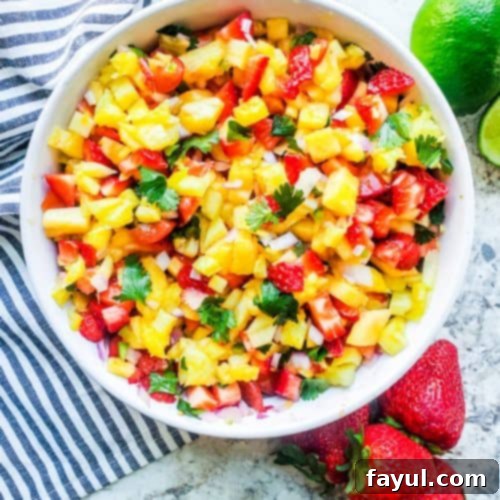 Overhead shot of salsa in a white bowl.