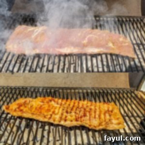 Prep image for grilled skirt steak recipe. Image shows meat on a charcoal grill.