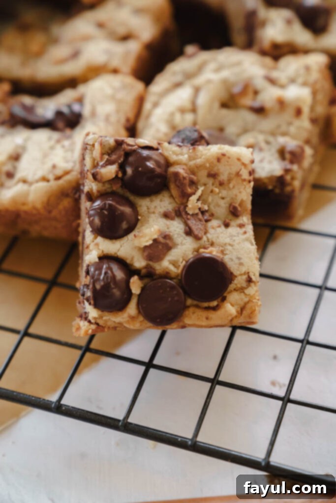 A stack of Dark Chocolate Toffee Blondies ready to be enjoyed.