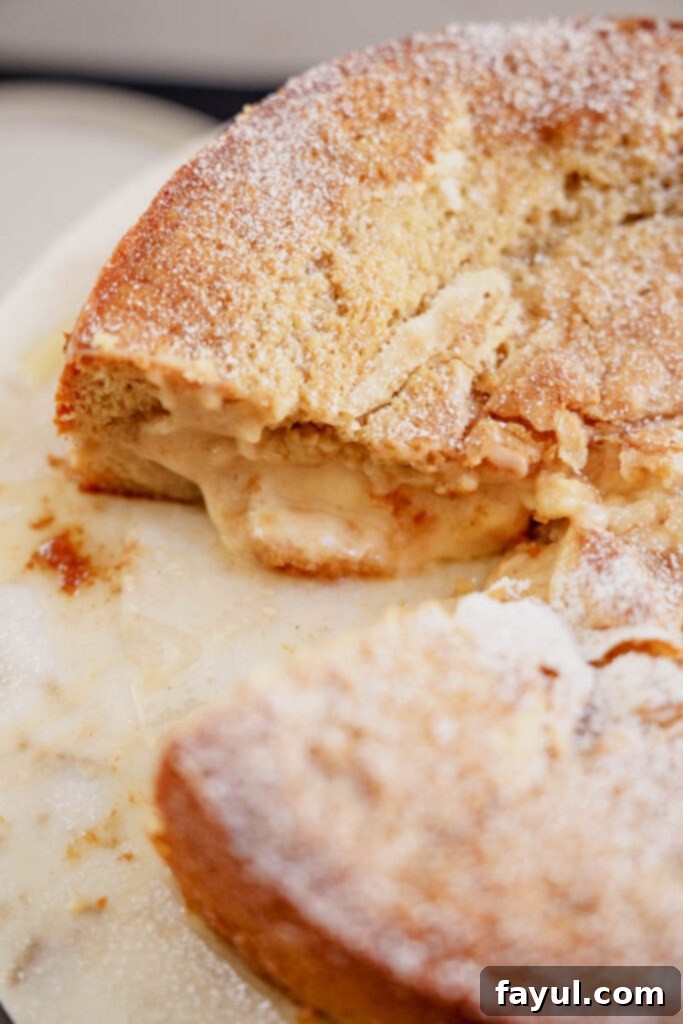 Slice of brown butter pear cake with cream cheese