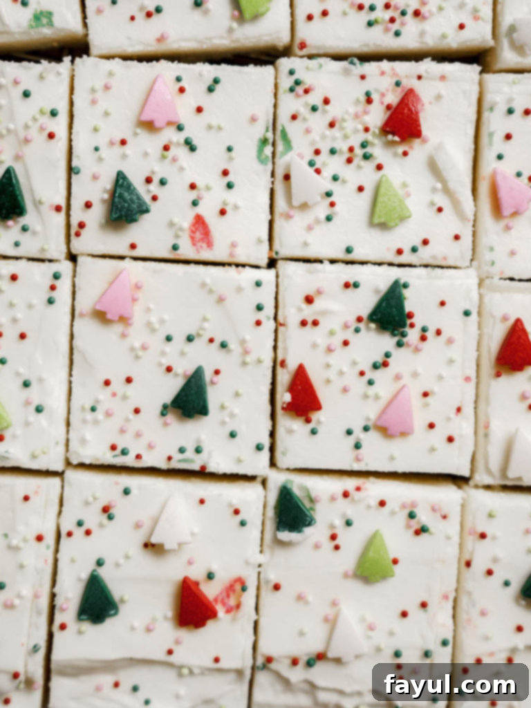 Delicious Christmas sugar cookie bars topped with festive sprinkles, ready for the holidays.