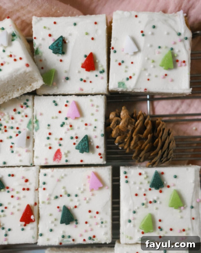 Sugar cookie bars baking in the oven, with a golden brown edge.