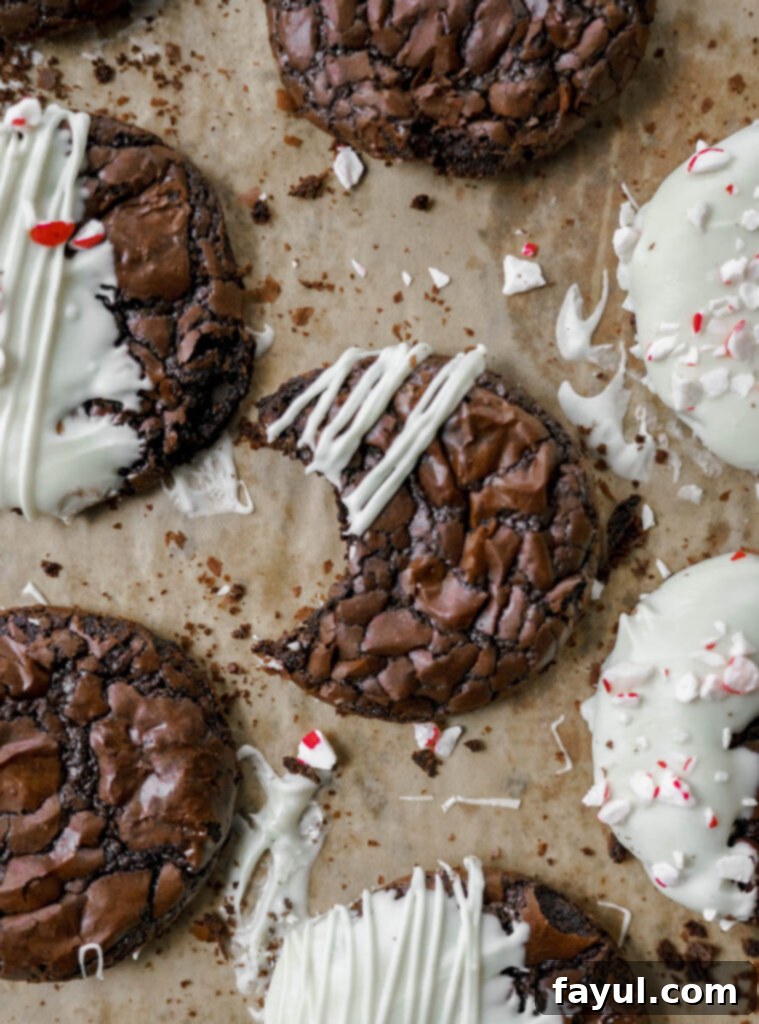 Close-up of a white chocolate dipped brownie cookie with peppermint