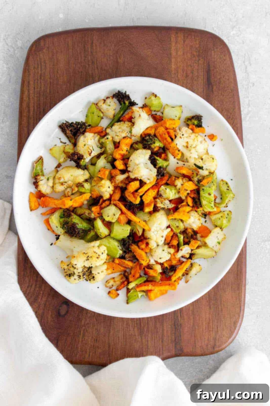 Overhead view of a plate of air fryer frozen vegetables, looking perfectly crispy and seasoned.