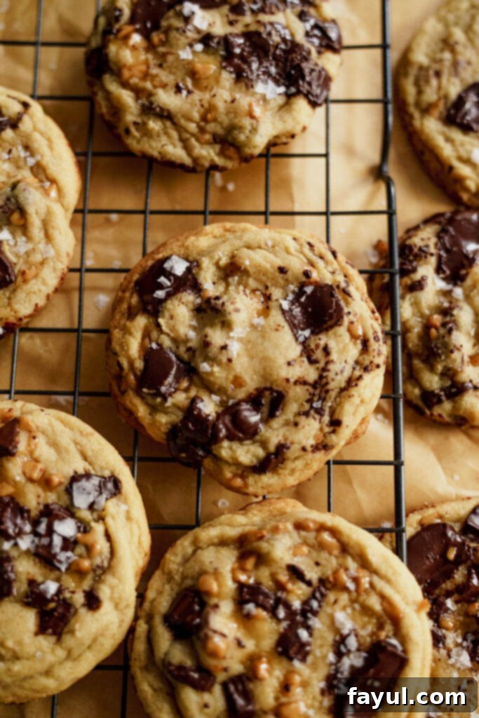 Espresso Toffee Chunk Cookies stacked on a white plate