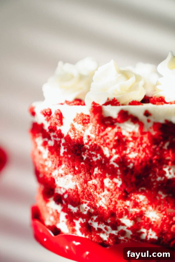 Top view of a decadent Red Velvet Cake with a generous layer of cream cheese frosting