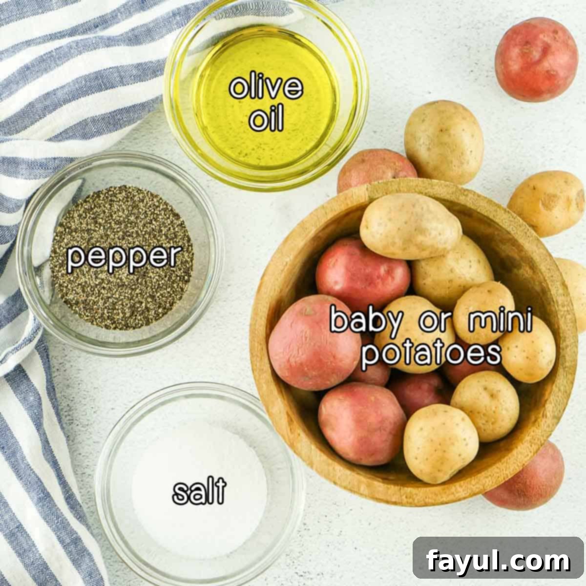Crispy Air Fryer Baby Potatoes 3 Overhead shot of ingredients - baby/mini potatoes, olive oil, pepper, and salt.