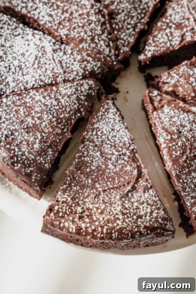 flourless chocolate cake with sliced strawberries