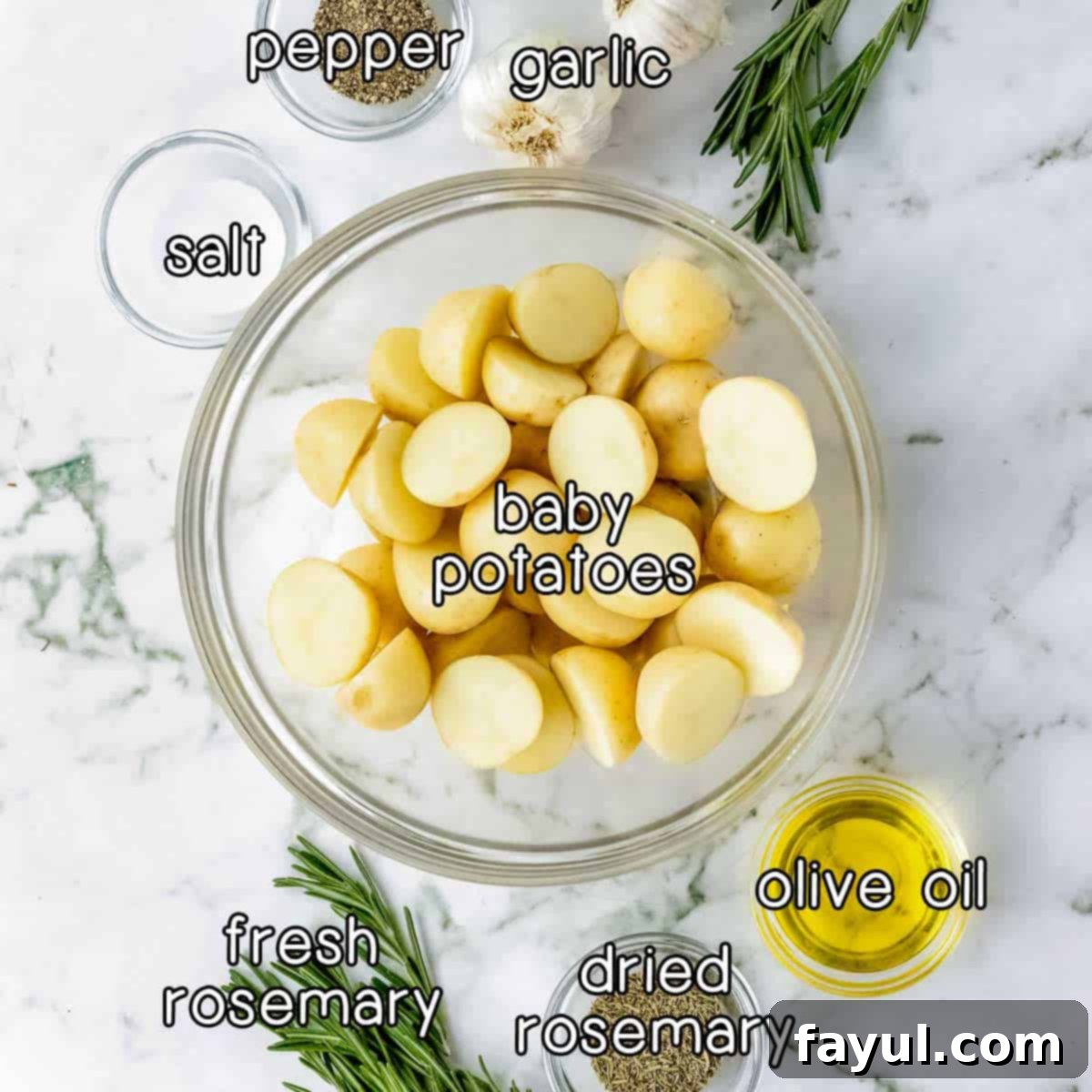 Overhead shot of ingredients - baby potatoes, salt, pepper, garlic, fresh rosemary, dried rosemary, and olive oil.
