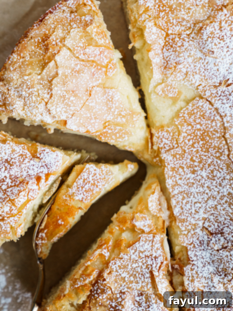 Slice of homemade gooey butter cake with a dense base and creamy topping