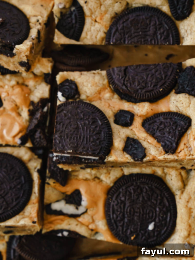 Peanut Butter Oreo Bars stacked high on a plate