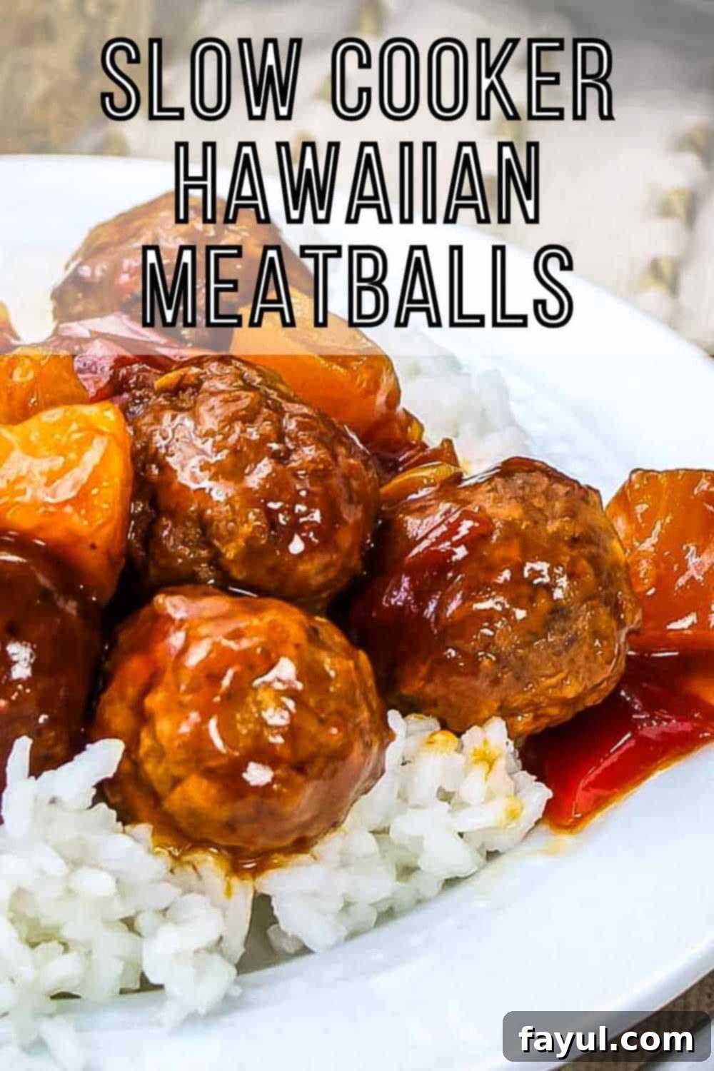 Side angled shot of Slow Cooker Hawaiian Meatballs over white rice in a white bowl with a white and yellow cloth in the background, showcasing their glossy, rich sauce.