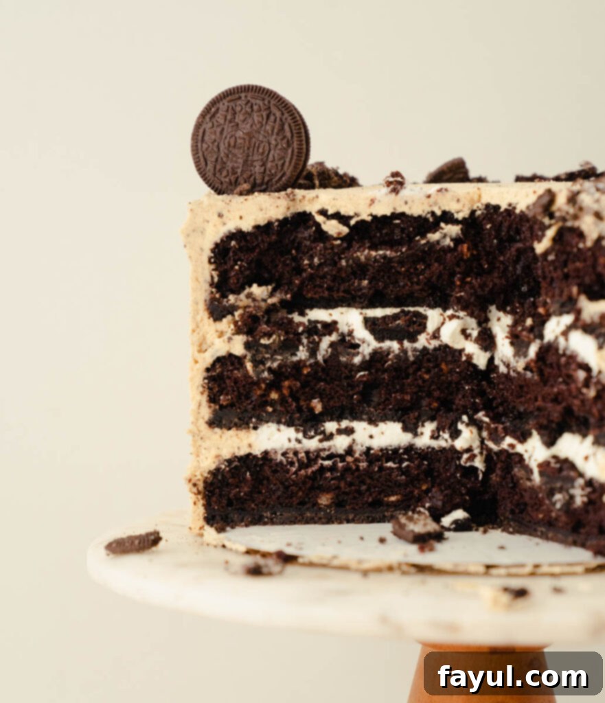 Layers of Oreo Peanut Butter Cake showing filling