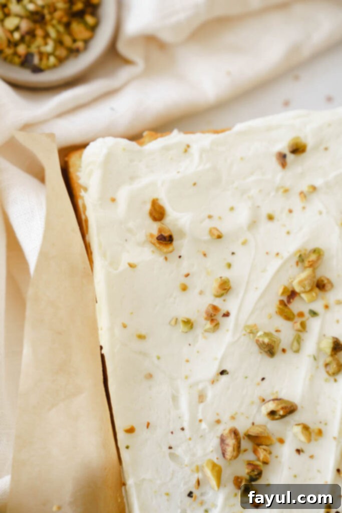 Pistachio Sheet Cake decorated with cream cheese frosting