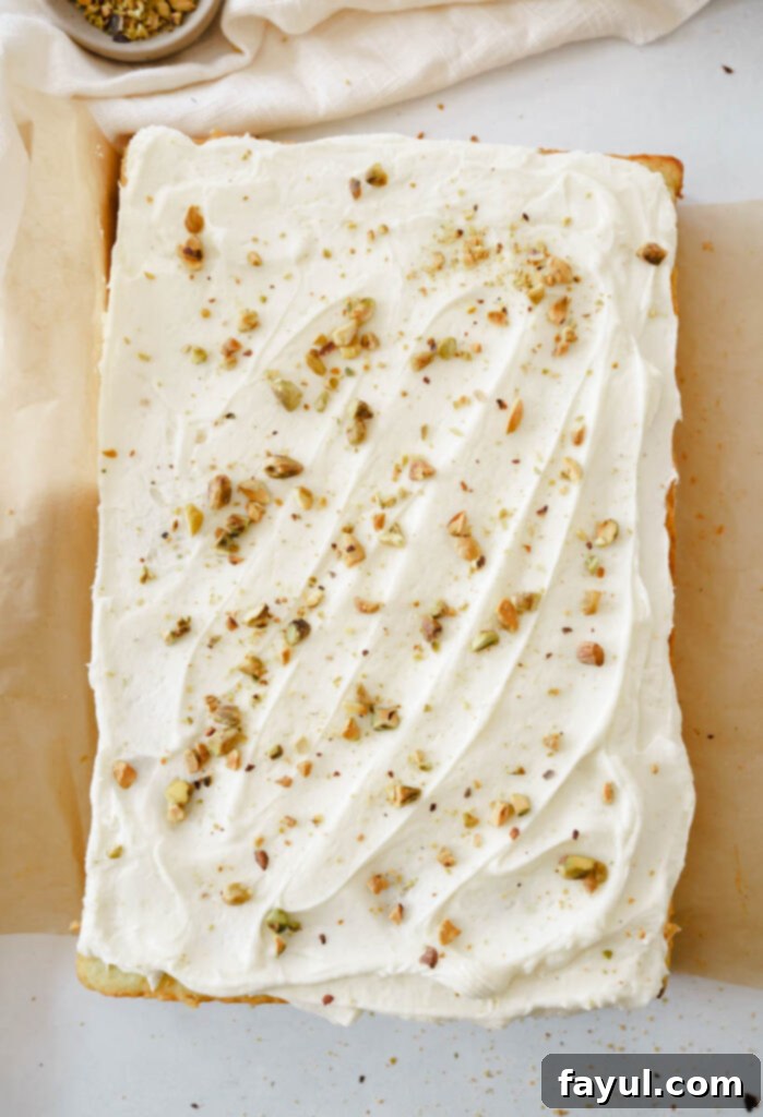 Pistachio Sheet Cake being decorated