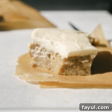 The finished banana snack cake with cream cheese frosting, ready to be served
