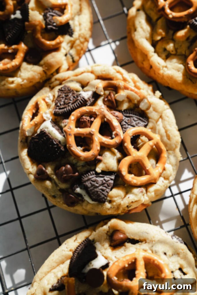 Close-up of Peanut Butter Oreo Pretzel Cookies with visible Oreos and chocolate chips