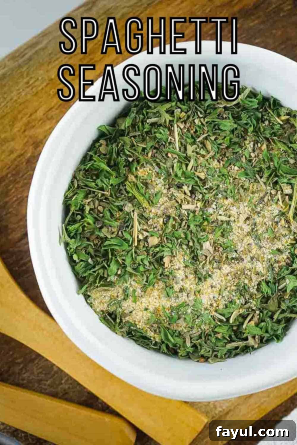 Overhead shot of seasoning in a white bowl on a wooden surface.