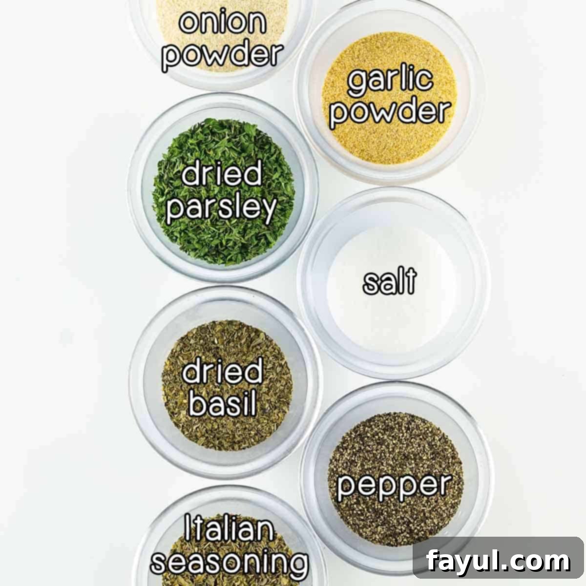 Overhead shot of ingredients - onion powder, garlic powder, dried parsley, dried basil, Italian seasoning, salt, and pepper.