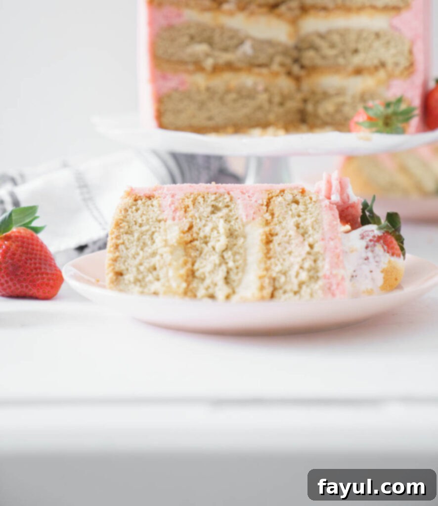 Slices of S'mores Strawberry Cake showcasing layers