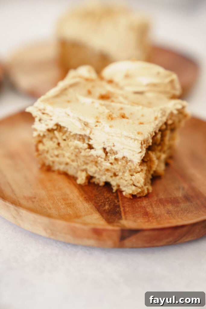 A slice of Biscoff Snack Cake with a fork