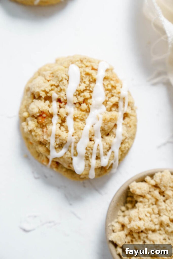 Close up of a freshly baked Carrot Crumb Cookie with cream cheese glaze