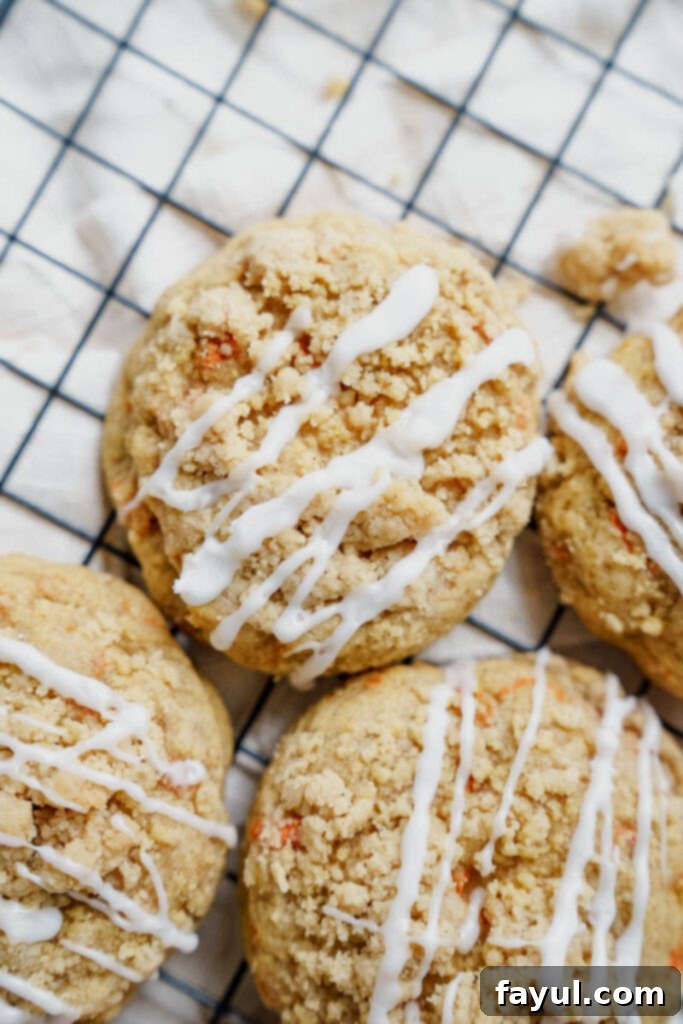A plate of freshly baked Carrot Crumb Cookies with cream cheese drizzle