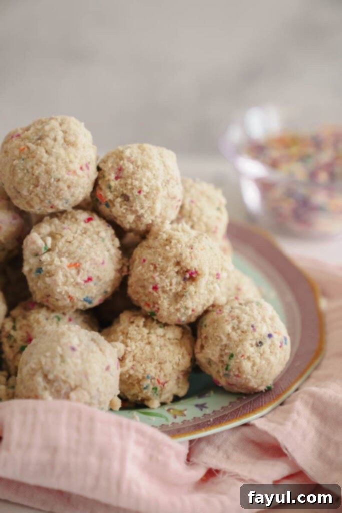 A beautifully arranged plate of finished Milk Bar style birthday truffles, ready to be enjoyed.