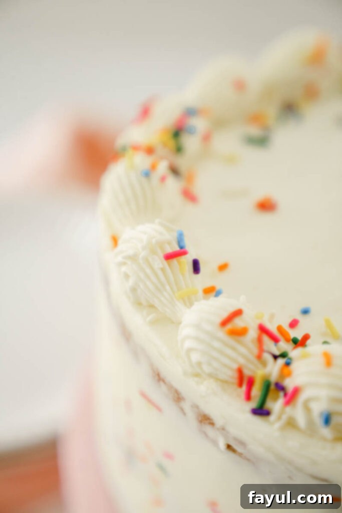 Sprinkles being folded into cake batter