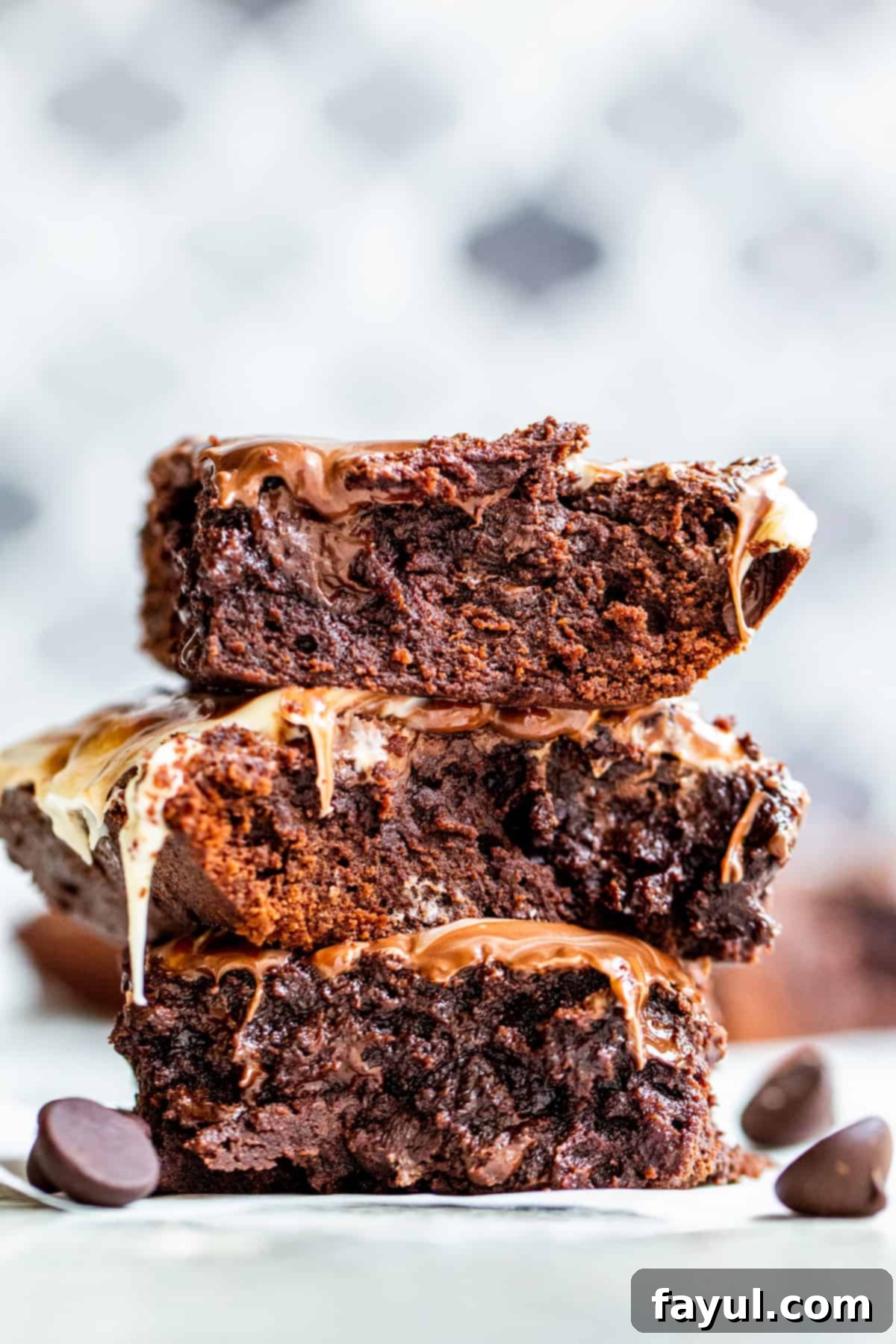 Strait on shot of fudge brownies in stack of three.