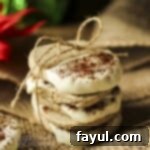 Side close up shot of four shortbread cookies stacked and tied together with a bow of twine.