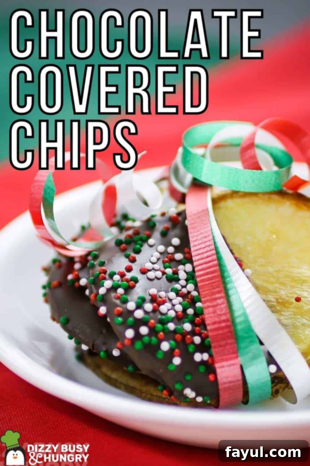 Side close up shot of multiple chocolate covered potato chips wrapped in red, green, and white ribbon on a small white plate on red and green tissue paper, highlighting the festive decor.