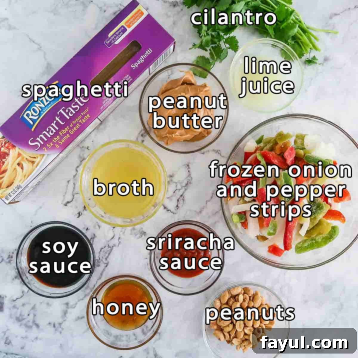 An overhead shot showcasing all the essential ingredients for One Pot Spicy Thai Noodles: fresh cilantro, uncooked spaghetti, creamy peanut butter, vibrant lime juice, convenient frozen onion and pepper strips, rich chicken broth, spicy sriracha sauce, savory soy sauce, golden honey, and crunchy peanuts for garnish.