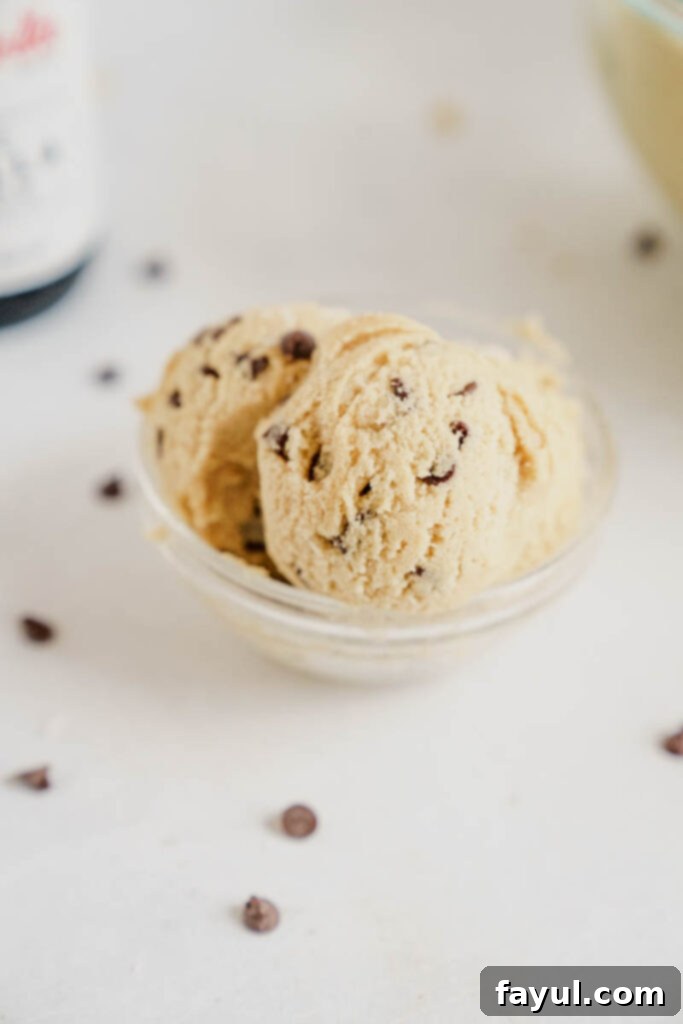 Effortless Edible Cookie Dough Bliss 11 Close-up of a spoon scooping edible cookie dough