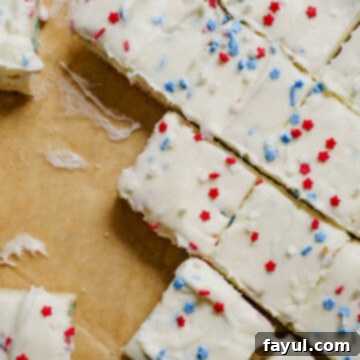Red, White, and Blue Sugar Cookie Bars with Cream Cheese Frosting