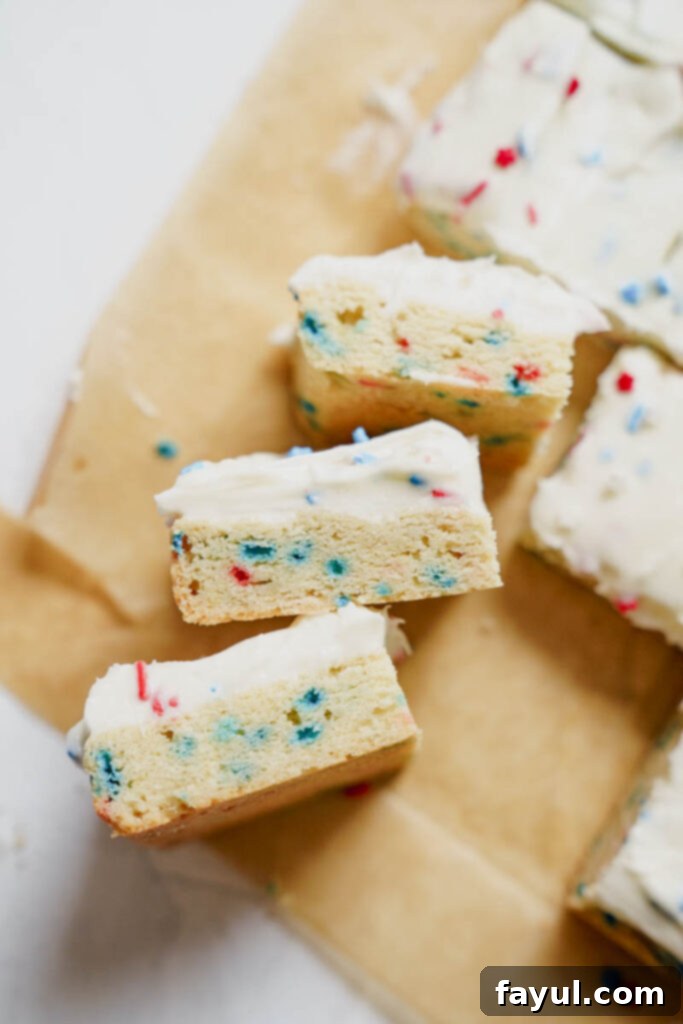 Two hands holding a sugar cookie bar