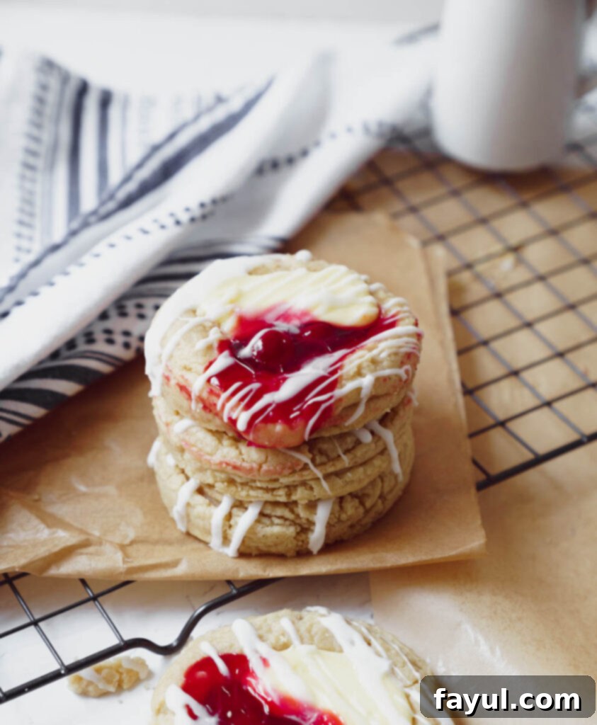 Close up of a cherry cheesecake cookie with a bite taken out