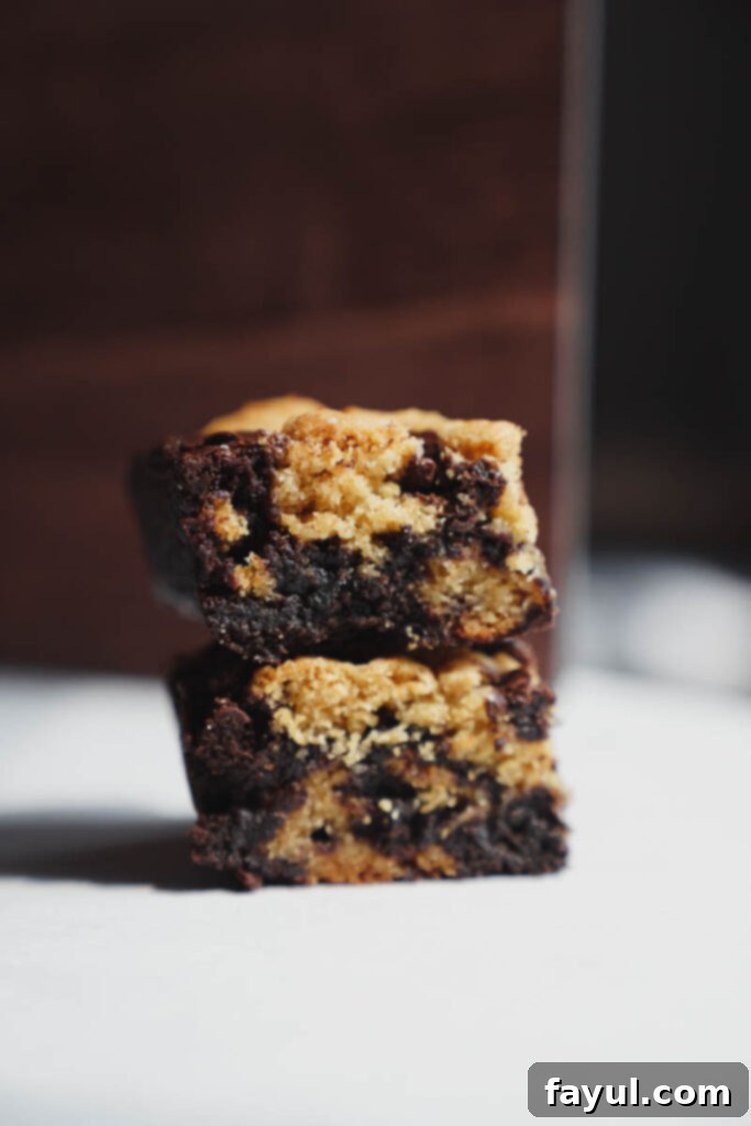Close-up of baked brookie bars showing the distinct layers.