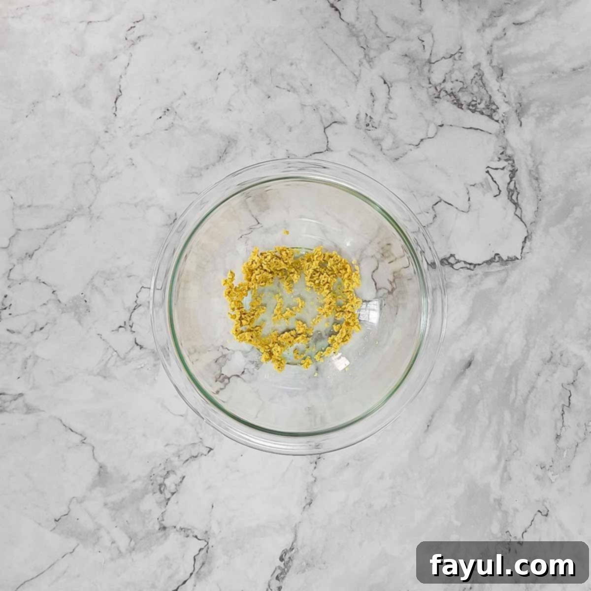 Overhead view of process shot 1 - crushing bouillon cube into powder.