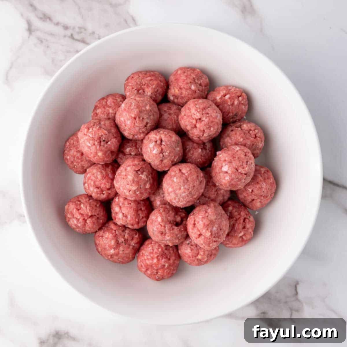 Overhead view of process shot 2 - shape the ground beef into balls.