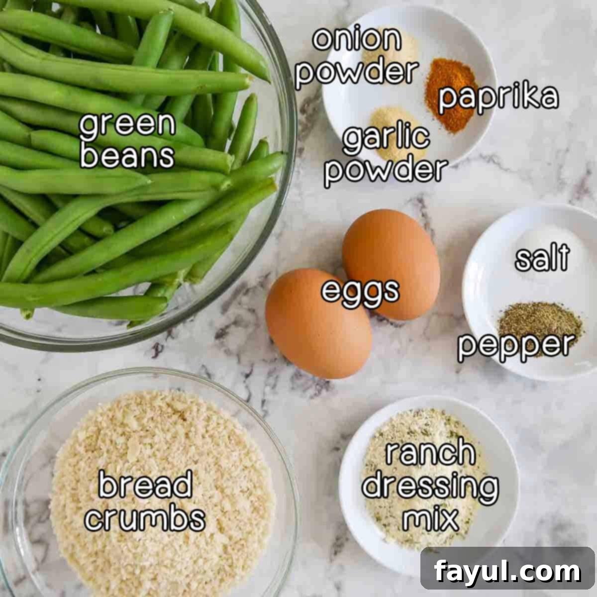 Overhead shot of all ingredients for crispy green bean fries: fresh green beans, eggs, panko bread crumbs, ranch dressing mix, salt, pepper, onion powder, garlic powder, and paprika.