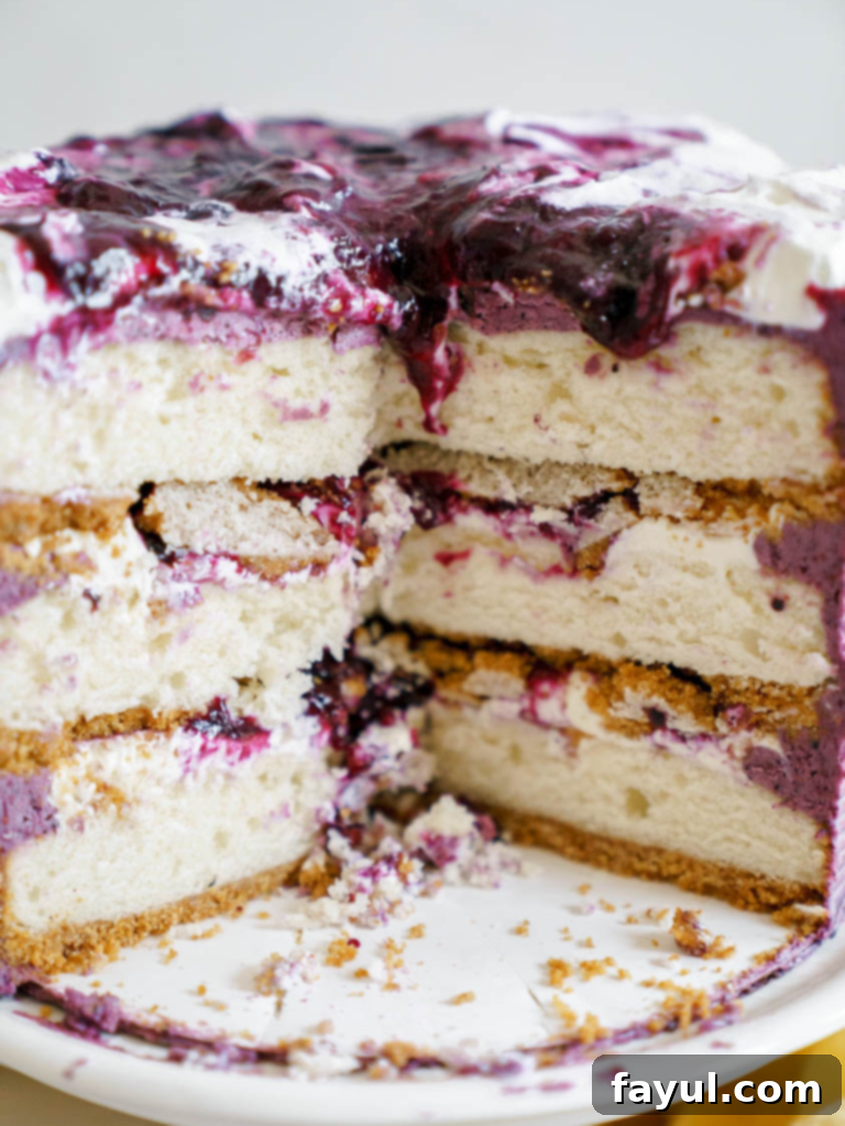 Exquisite layered blueberry cheesecake cake with fresh blueberries and a graham cracker crust