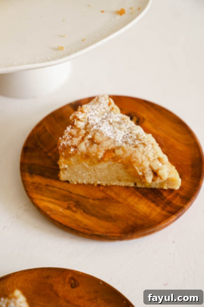 Close-up of baked peach cobbler cake showing the golden streusel